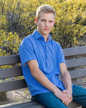 Portrait Of A Male High School Senior On A Bench In Sabino Canyon
